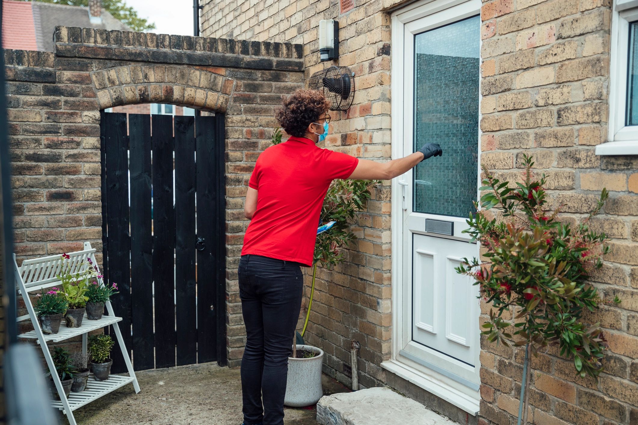Professional approaching a residential property entrance