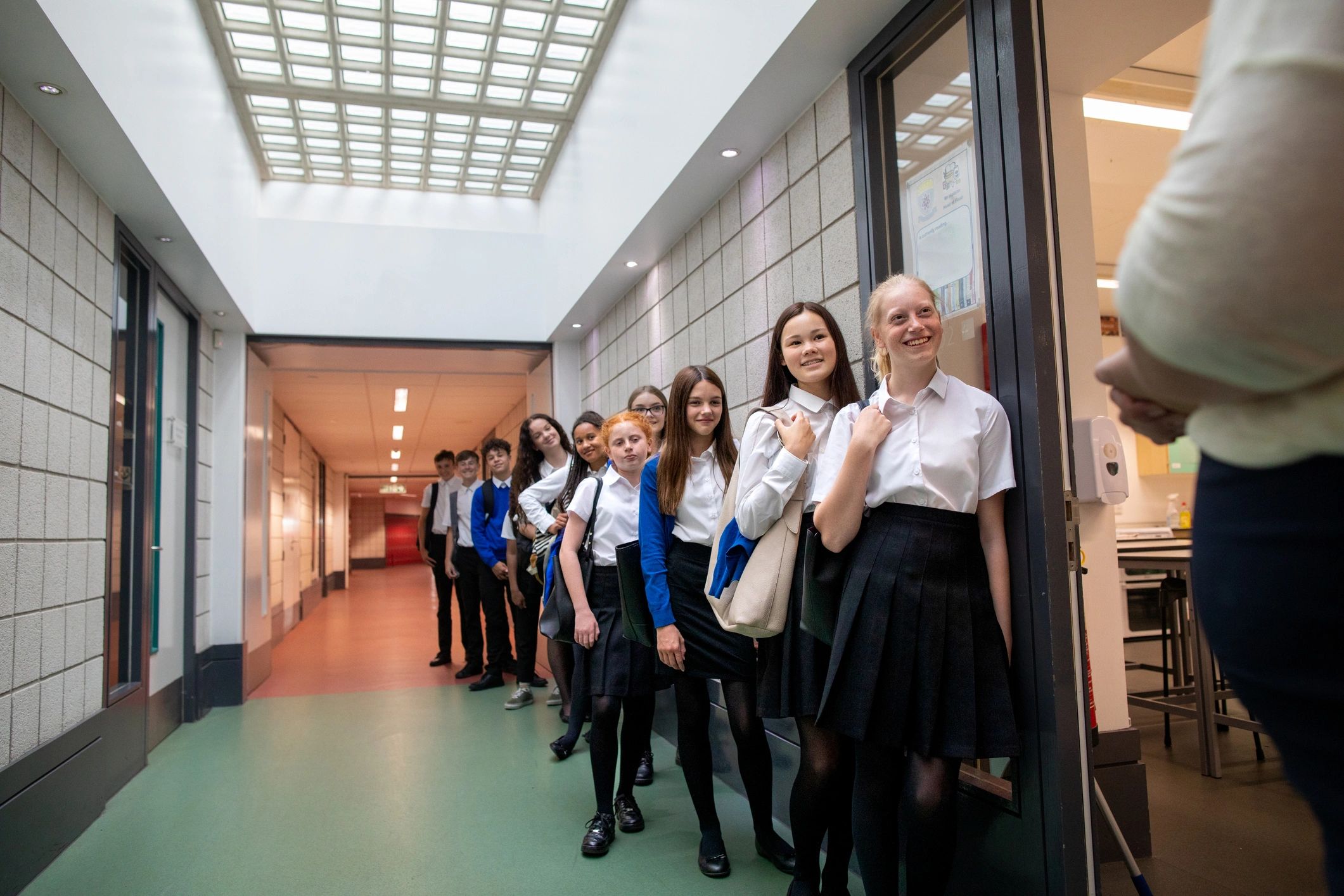 Students lined up at a private school entrance